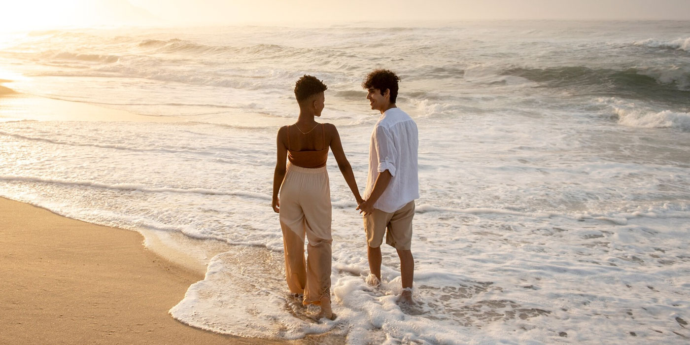 Couple-Walking-on-Beachfront