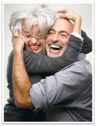 Older couple laughing and hugging