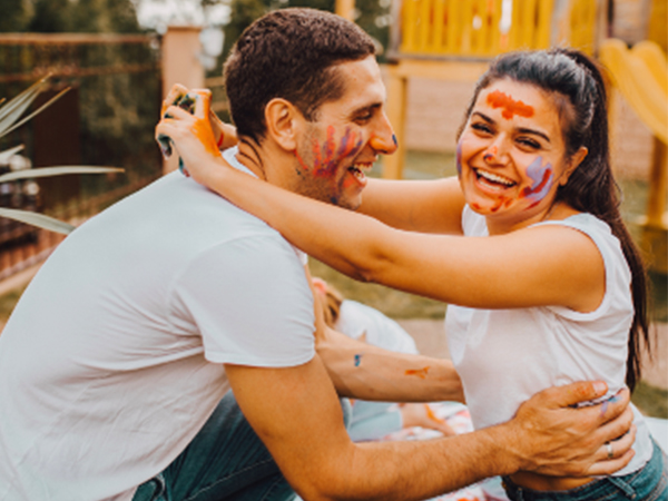Couple-laughing-with-paint-on-their-faces