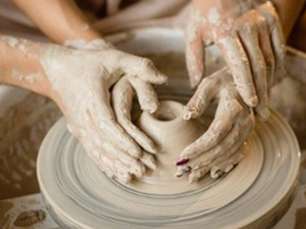 Couples-hands-with-pottery-clay