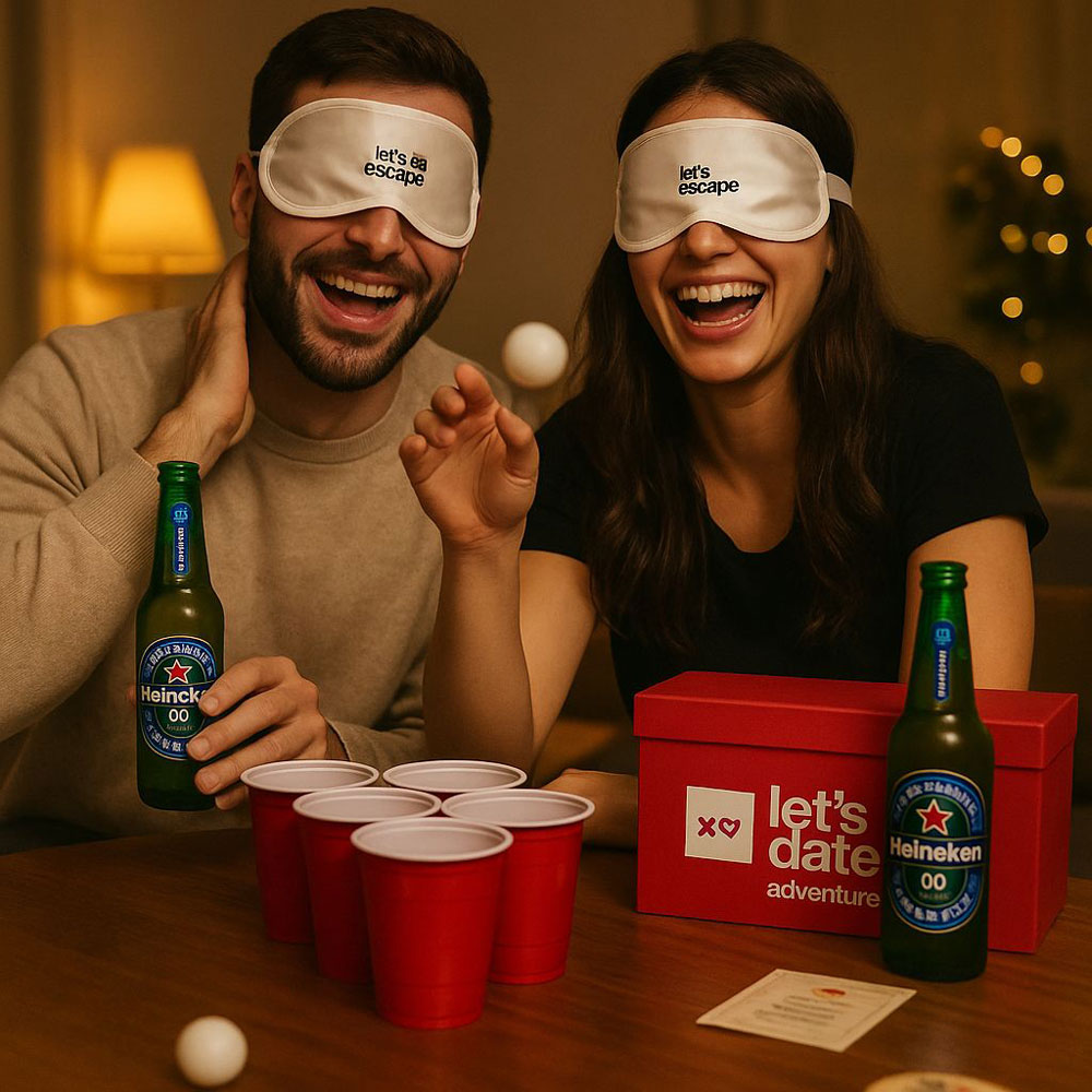 A-couple-laughing-while-playing-with-Lets-Date-Beer-Pong-Date-Box